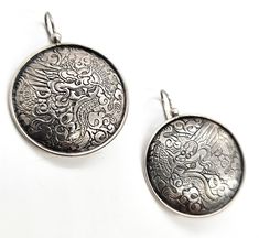 Silpada Chinese Dragon Asian tribal large shield signed sterling silver earrings. Good used condition with little signs of normal wear. These unique rare Silpada earrings are stamped on the back with the Silpada hallmark and 925. Acid tests positive for sterling silver. Earrings measure 1 and 3/4ths of an inch tall and 1 and 1/4 of an inch across. Silver Etched Round Earrings, Unique Silver Etched Earrings, Unique Etched Silver Earrings, Vintage Silver Medallion Earrings, Silver Sterling Silver Medallion Earrings, Traditional Silver Etched Earrings, Silver Symbolic Engraved Earrings, Traditional Etched Silver Earrings, Silver Engraved Symbolic Earrings