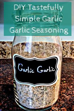 a glass jar filled with garlic seasoning sitting on top of a granite countertop