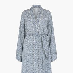 The charming Corina robe is cut from our inimitable cotton and adorned with an interesting blue Ditsy floral print. This oversized kimono-inspired robe boasts fluted sleeves and a detachable belt, creating a flattering silhouette. Contrast piping on the cuff and neck, complete this effortlessly feminine piece.    Cool machine wash only. Wash inside out and with similar colours 100% Cotton Modal   Cool machine wash only. Wash inside out and with similar colours Oversized Kimono, Fluted Sleeves, Blue Lily, Luxury Scarves, Floral Robes, Nightwear Women, Ditsy Floral Print, Contrast Piping, Gifts For New Mums