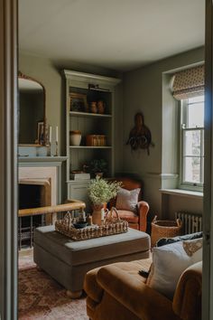 a living room filled with furniture and a fire place