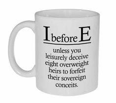 a white coffee mug with the words i before e on it