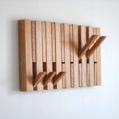 a wooden sculpture on the wall that is made out of wood