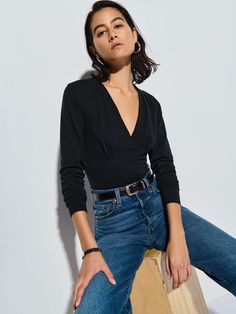 We heard you were looking for that simple, elegant staple that goes with everything. This top features pleats at the bodice and bust, waist panels, and a V-neckline. Simple, yet elegant. (This one comes in Jet Black.) | Andy Top in Jet Black | Ethical Essentials Nation Ltd, Romper And Jacket, Pleated Top, Pleat Top, Mother Denim, Trina Turk, New Tops, New Arrival Dress, Shades Of Black