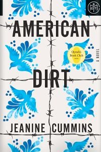 the cover of american dirt by jeanie cumins, with blue flowers painted on it