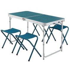 two folding chairs and a table set up on top of each other with one chair facing the same direction