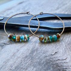 "I am in love with these! These are completely hypoallergenic, pure titanium hoops. The color of the hoop is a choice between vintage bronze, or turquoise. Both are shown. There are no dyes added to the metal to make this color, it is completely safe for those with sensitive ears. The beads are a mix of brown, aqua, teal, and white. Absolutely stunning beads. The beads are 3 x 5mm Czech glass. If you would like a different size hoop than what is listed, please ask. I am always happy to work with Czech Glass Hoop Earrings As Gift, Mint Green Earrings, Beautiful Beaded Earring, Teal And Brown, Earrings For Sensitive Ears, Brown Earrings, Titanium Earrings, Hypoallergenic Jewelry, Small Earrings Studs