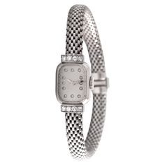 Boucheron Paris Diamond 18K White Gold Wristwatch Set with 8 diamonds. French marks. Circa 1950. Reference number: 72608. Case dimensions: 2.20 x 1.30 centimeters. Length: 18.00 centimeters. Width bracelet: approximately 0.60 centimeters. Weight: 36.12 grams. We do not guarantee the functioning of this watch. White Diamond Watch With Chronometer, Boucheron Necklace Serpent, Boucheron Quatre Ring, Boucheron Place Vendome, Boucheron Serpent Boheme, Diamond White, Jewellery And Watches, Wrist Watch, White Gold