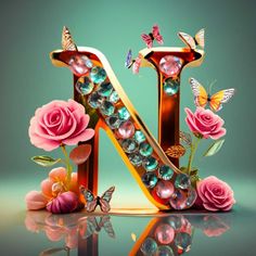 the letter n is made up of flowers and butterflies, with jewels on each letter