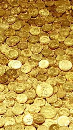 a pile of gold coins sitting on top of each other