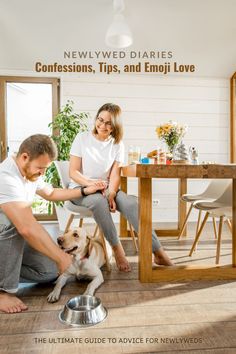 a man and woman petting a dog on the floor in front of a table