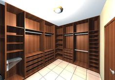 an empty walk in closet with wooden shelves