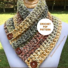 a crochet scarf with buttons on it