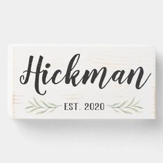 a wooden sign that says hickman est 2020