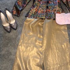 A Beautiful Pair Of Dress Pants. Paired With Silver And Gold Heals Pink Purse And Multiple Color Jacket. Inseam Is 32 Inches. Womens Gold Pants, Elegant Silk Bottoms For Festive Season, Silk Straight Pants For Festive Occasions, Festive Silk Evening Bottoms, Festive Wide Leg Silk Pants, Glamorous Spring Festive Sets, Festive Workwear Straight Pants, Fitted Bottoms For Formal Holiday Occasions, Chic Ankle-length Pantsuit For Party