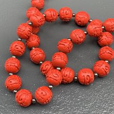 Vintage ~ Hand carved Chinese Cinnabar Beaded Necklace featuring are 1/2 inches in diameter beads which are deeply carved , with Floral /scroll patterns all around ~ Necklace ends with tongue and box clasp Measurements : Necklace measures 22 1/2 inches in length x 1/2 inches max width Condition : Good vintage condition ~ Very less surface ware ~ Most likely its restrung recently ~ Clasp is in good working order , but looks to be a replacement /later addition . Please Note ~ As vintage items are Chinese Jewelry, Scroll Pattern, Box Clasp, Ring Photos, Glass Necklace, Clear Crystal, Sterling Silver Bracelets, Fashion Bracelets, Handcrafted Jewelry