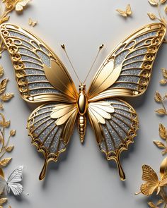 a golden butterfly sitting on top of a white surface next to gold flowers and leaves