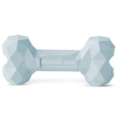 a dog bone shaped toy with the word mount art on it's front end