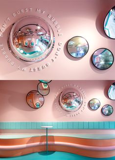 there are many circular mirrors on the wall