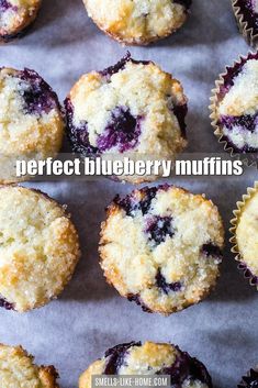 blueberry muffins on a baking sheet with the words perfect blueberry muffins above them