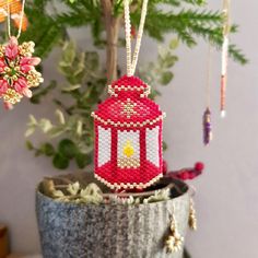 a red lantern ornament hanging from a tree