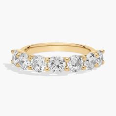 three stone diamond ring in yellow gold