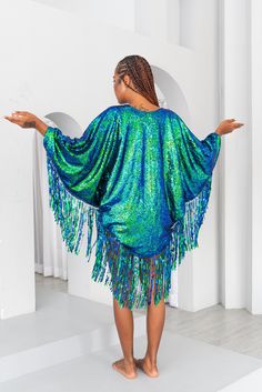 Mermaid Green sequin kimono with sequin fringe. It's BACK! After two years of not being able to source our mermaid material, at last it's back in stock and we are making the most of it! Handmade sequin kimono to add that touch of glamour to any festival outfit, rave wear or beach party. Mermaid sequin material and sequin fringing make this a truly original, unique sequin cape. It's one size and looks beautiful on a UK size 8 - 18. If you require custom sizing, just drop us a message and let's se Summer Sequin Dress With Fringe, Summer Party Sequined Kaftan, Sequin Beach Dress For Beach Season, Beach Dresses With Sequins For Beach Season, Summer Party Sequin Kaftan, Beach Season Sequined Dresses, Summer Party Kaftan With Sequins, Spring Party Kaftan With Sequins, Party Festival Sequins Kaftan