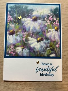 a birthday card with daisies and butterflies on the front, says have a beautiful birthday