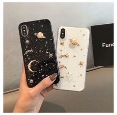 two phone cases with stars and moon designs on them, one is black and the other is white