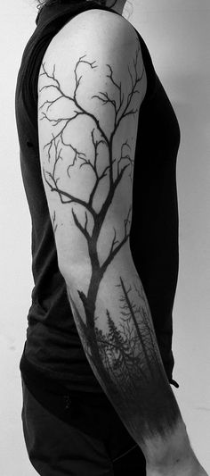 a woman with a tree tattoo on her arm