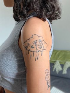 a woman with a tattoo on her arm