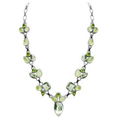 Gorgeous necklace for that special occasion! Get some sparkling green amethyst earrings to wear with it! GMER021419-02 There may be slight variation in sizes, shapes, colors and patterns Stones: The Green Amethyst (the official name is Praiolite), Peridot & Prehnite Length: Adjustable length approx. 17" - 19" Width: Bottom green amethyst stone approx. 3/4" long x 1/2" wide Material: .925 Silver Made in: India