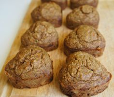 some muffins are sitting on a cutting board