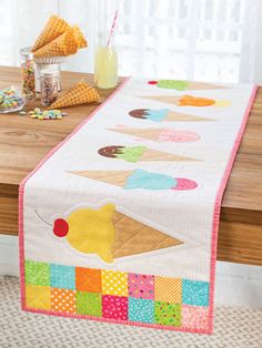 an ice cream cone table runner on a wooden table