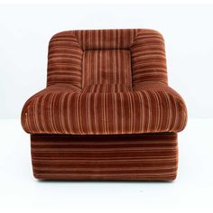 a chair that is sitting on top of a white table with a brown and red stripe pattern