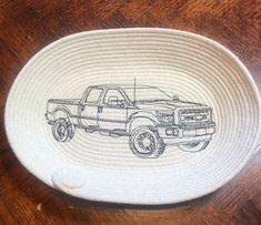 a bowl with a drawing of a pickup truck on it