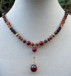 Gemstones in rich, warm tones, aaa luxe gems and 14k gold filled clasp and components, 19 inches in length. The centerpiece is a large perfectly faceted, flawless whiskey quartz gemstone briolette. Gemstones include: Quartz Garnet Hessonite garnet Jade Autumn Necklace, Hessonite Garnet, Necklace Gemstone, Fancy Jewelry, Autumn Colors, Chain Styles, Gemstone Necklace, Stone Beads, Beaded Earrings