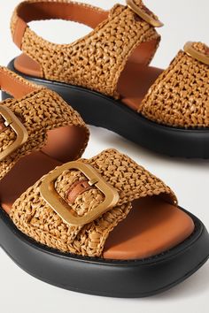 Find TOD'S Buckled Leather-trimmed Raffia Sandals on Editorialist. Tod's sandals are topped with two chunky gold-tone buckles, and each one is etched with the brand's lettering. They've been made in Italy from raffia and have brown leather trims to match the smooth lining. Wear yours all summer long. Luxury Woven Leather Sandals For Vacation, Luxury Woven Leather Sandals For Summer, Luxury Straw Sandals With Woven Sole, Designer Sandals With Woven Straw Sole, Luxury Straw Sandals For Summer, Luxury Summer Straw Sandals, Designer Straw Open Toe Sandals, Designer Open Toe Straw Sandals, Luxury Open Toe Straw Sandals