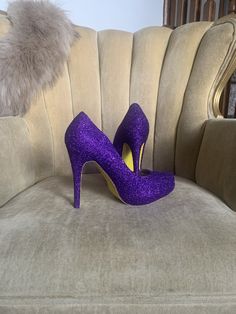 Royal purple covers the entire top portion of the heels while the underside is covered in an ultra fine yellow glitter. These heels can be made in any color combo desired. If you would like another color combination please leave your color choices at checkout otherwise your pair will be created in the colors shown. Prom Yellow, Yellow High Heels, Heels Purple, Womens Costume, Glitter High Heels, Yellow Glitter, Yellow Heels, Costume Shoes, Purple Shoes