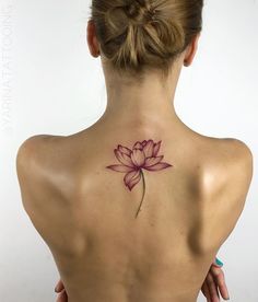 a woman with a tattoo on her back