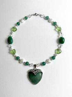 Green Aventurine Love Necklace 16 in. Made with stainless steel wire, glass beads, green aventurine beads, metal beads, pearl beads, green aventurine heart charm. Green Aventurine Necklace, Aventurine Necklace, Green Beaded Necklace, Wedding Jewellery Necklace, Stainless Steel Wire, Cute Necklace, Black Necklace, Cool Necklaces, Green Necklace