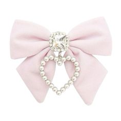 a pink bow with pearls on it