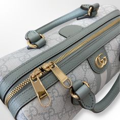 Gucci Ophidia Small top handle bag Signature GG Supreme canvas Dusty blue leather accents Cotton linen lining Light gold finished hardware Dusty blue and light blue Web stripe Double G logo Leather double top handle Removable and adjustable leather shoulder strap (Drops: 47.8 cm) Zip closure Inside zipped pocket Size: 26.4 × 17.3 × 14 ... Small Top Handle Bag, Double G Logo, Gucci Ophidia, G Logo, Lv Handbags, Bottega Veneta Shoulder Bag, Leather Accents, Blue Top, Lv Bag