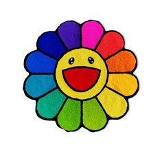 a colorful flower with a happy face drawn on it