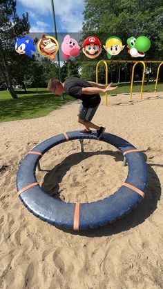 a young man riding a skateboard on top of a blue ring in the sand