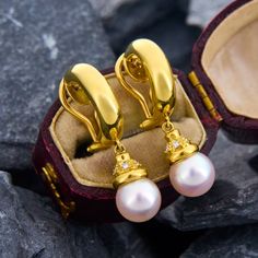 These beautiful Akoya pearl drop earrings are crafted of rich 18k yellow gold. The pearls are 7.8mm and the cap on each pearl holds 6 genuine diamonds. The earrings have a total drop length of 30mm, just over 1 1/4 inches. Hallmarked Yellow Gold Pearl Drop Earrings, Luxury Gold Pearl Earrings With Pearl Charm, Luxury Gold Pearl Earrings With Charm, Luxury Gold Pear-shaped Pearl Earrings, Yellow Gold Akoya Pearl Pear Earrings, Luxury Pearl Drop Clip-on Earrings, Luxury Pearl Drop Clip-on Earrings For Formal Occasions, Luxury Akoya Pearl Earrings With High Luster, Elegant Yellow Gold Pearl Earrings With Pendant