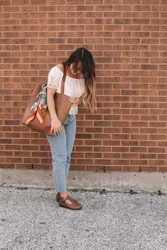 A classic leather tote is a wardrobe staple every girl needs in their life. It’s buttery soft, warm brown leather and minimalistic yet functional design make this a bag that will fit seamlessly into your life. Whether it’s tagging along for a weekend trip to the farmer’s market, holding all your work or school necessities, or traveling with you around the world, you’ll find this beautiful genuine leather tote the bag you reach for over and over again. PRODUCT DETAILS Made with 100% high-quality Classic Leather Tote, Handmade Leather Boots, Functional Clothing, The Farmer, Genuine Leather Totes, Classic Brown, Girl Needs, Weekend Trip, Warm Brown