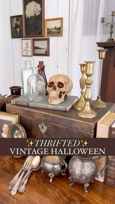 there is a wooden table with various items on it and the words thrifted vintage halloween