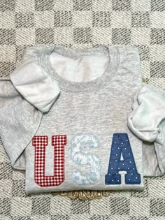 a white shirt with the letters usa on it