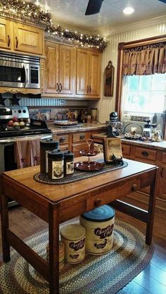 a kitchen filled with lots of wooden furniture