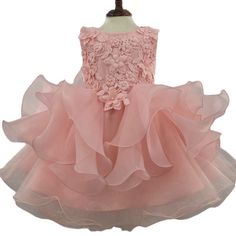 This Exquisite Dress Is Crafted With The Utmost Care And Attention To Detail, Ensuring A Flawless Fit And Supreme Comfort For Your Little One. The Sleeveless Design Allows For Freedom Of Movement, Keeping Your Child Cool And Comfortable Throughout The Event. The Delicate Floral Appliques Adorn The Dress, Creating A Beautiful And Feminine Look. Each Applique Is Meticulously Embroidered, Showcasing Intricate Details And Patterns That Add A Touch Of Elegance And Sophistication. Fabric: Tulle Color: Pink Sleeveless Pageant Dress For Spring, Sleeveless Summer Princess Dress For Pageants, Pink Sleeveless Dress For Spring Pageant, Sleeveless Ruffled Princess Dress For Wedding, Princess Style Sleeveless Dresses With Floral Embroidery, Sleeveless Dress With Appliques For Dress-up, Sleeveless Dresses With Appliques For Party, Sleeveless Ruffled Dress For Dress-up, Fitted Princess Sleeveless Dress With Ruffles